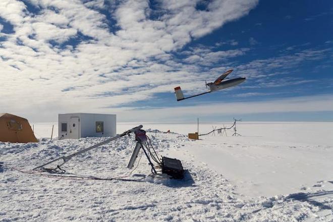 A launched drone bound for collecting air samples for isotopic analysis at EastGRIP, Greenland. (Credit: Ole Zeising/Alfred-Wegener-Institute)