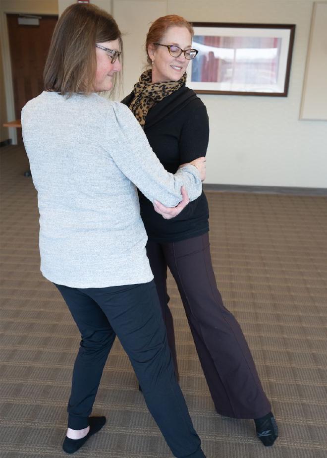Lise Worthen-Chaudhari (right) teaches Aimee Kain (left) the adapted Argentine tango, a version designed to protect patients with neuropathy and prevent them from falling while dancing. Credit: The Ohio State University Comprehensive Cancer Center