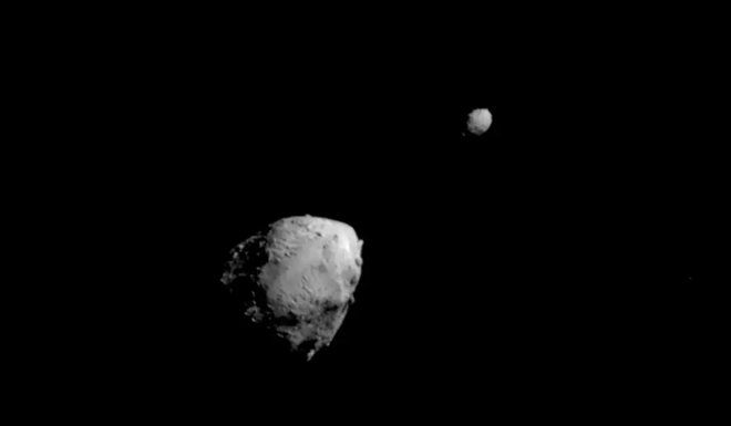 This image of asteroid Didymos**, left and Dimorphos was captured by NASA&rsquo;s DART mission a few seconds before the spacecraft smashed into Dimorphos on Sept. 26, 2022. The impact on the smaller asteroid has a measurable effect on the orbit of its larger partner. Image credit: NASA/Johns Hopkins APL