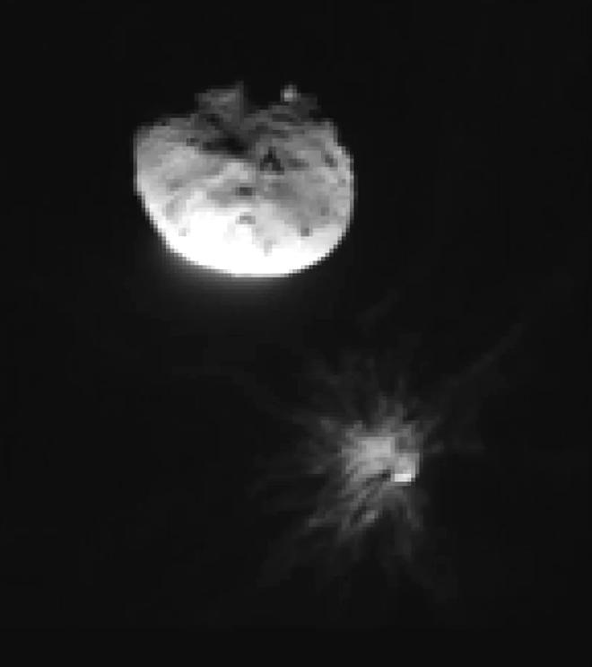 The Italian Space Agency&rsquo;s LICIACube traveled alongside NASA&rsquo;s DART to capture the spacecraft&rsquo;s collision with Dimorphos. In this LICIACube, taken moments after impact on september 26, 2022, rocky debris can be seen fanning out from the smaller asteroid below its larger binary partner, Didymos. Image credit: ASI/NASA