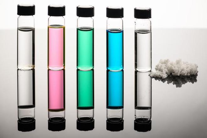 Vials of seawater, Great Salt Lake water, nickel sulfate, copper chloride wastewater, and desalinated water, along with recovered salts show how a new approach developed by URochester researchers turns natural and industrial waters into fresh water and reusable minerals. Image credit: University of Rochester photo / J. Adam Fenster