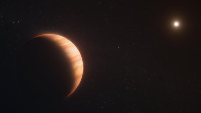 An orange gas giant planet at left, taking up about one-third of the frame, facing a star, which appears at top right as a far smaller bright dot. The planet has subtle orange cloud bands. The star illuminates the right side of the planet like the crescent of a waxing moon. Both are on the black background of space. The words “artist’s concept” are in the bottom right corner. Image credit: NASA, ESA, CSA, R. Crawford (STScI)