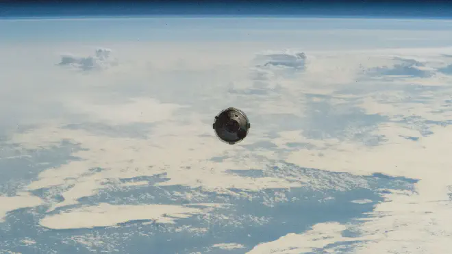 Starliner in a view from the space station, during the approach maneuvers while flying over the south of the Pacific Ocean. Image credit: NASA