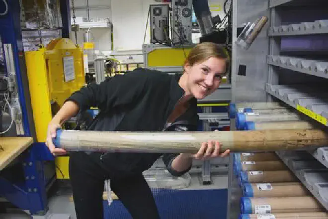 UCR’s Sandra Kirtland Turner holding a core sediment sample. (International Ocean Drilling Program)